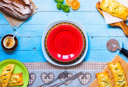 Delicious pie with spinach, made at home, on a wooden background, top viewの写真素材