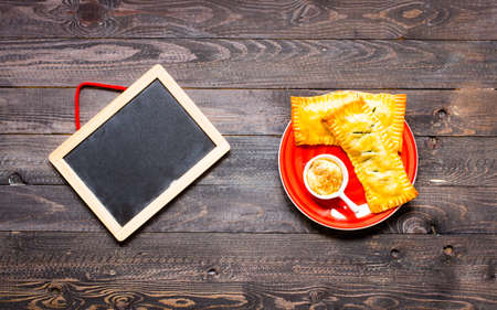 Delicious pie with spinach, made at home, on a wooden background, top viewの写真素材