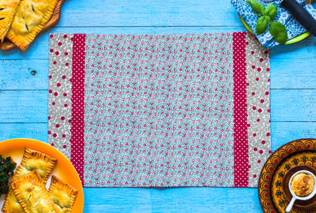 Delicious pie with spinach, made at home, on a wooden background, top viewの写真素材