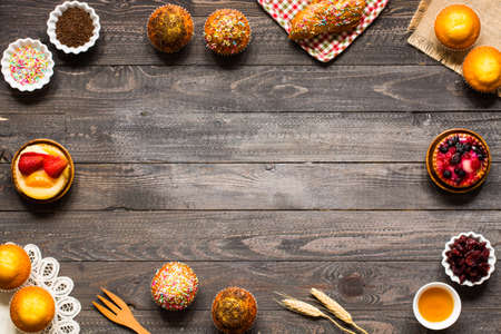 Delicious homemade muffins with yogurt, on a wooden background with space for text. Top viewの写真素材