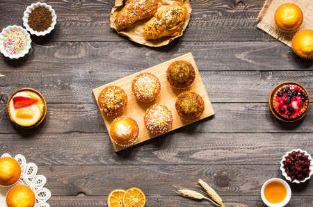 Delicious homemade muffins with yogurt, on a wooden background with space for text. Top viewの写真素材