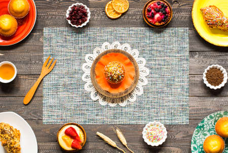 Delicious homemade muffins with yogurt, on a wooden background with space for text. Top viewの写真素材
