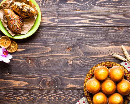 Delicious homemade muffins with yogurt, on a wooden background with space for text. Top viewの写真素材