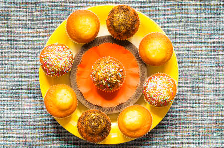 Delicious homemade muffins with yogurt, on a wooden background with space for text. Top viewの写真素材