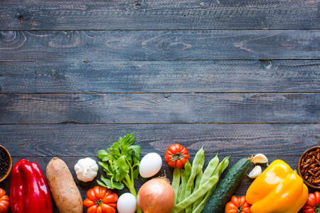 Different types of vegetables, on a old wooden table, space for text. Top viewの写真素材