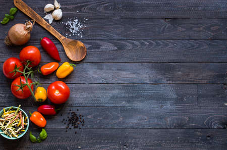 Delicious pasta with fresh vegetables and cheese, on a wooden background . Top viewの写真素材