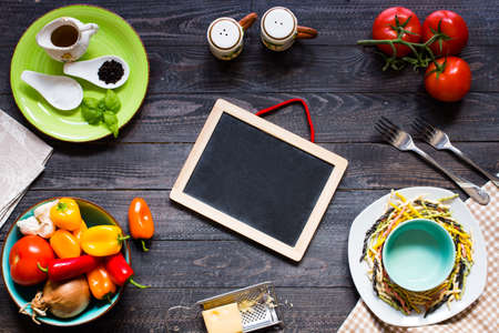 Delicious pasta with fresh vegetables and cheese, on a wooden background . Top viewの写真素材
