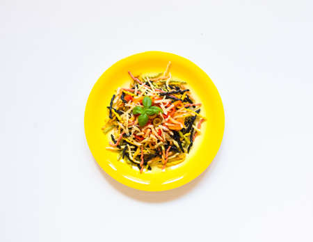 Delicious pasta with fresh vegetables and cheese, on a wooden background . Top viewの写真素材