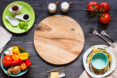 Delicious pasta with fresh vegetables and cheese, on a wooden background . Top viewの写真素材