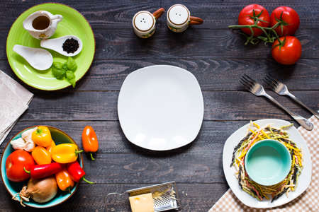 Delicious pasta with fresh vegetables and cheese, on a wooden background . Top viewの写真素材