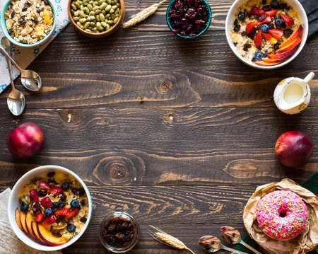 Healthy breakfast with milk,muesli and fruit, on a wooden background. Top viewの写真素材
