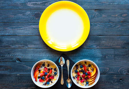Healthy breakfast with milk,muesli and fruit, on a wooden background. Top viewの写真素材