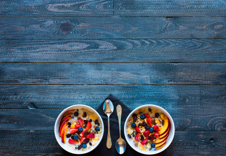 Healthy breakfast with milk,muesli and fruit, on a wooden background. Top view