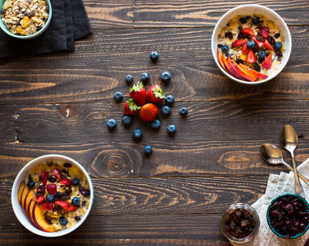 Healthy breakfast with milk,muesli and fruit, on a wooden background. Top viewの写真素材