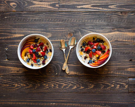 Healthy breakfast with milk,muesli and fruit, on a wooden background. Top viewの写真素材