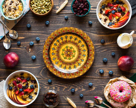 Healthy breakfast with milk,muesli and fruit, on a wooden background. Top viewの写真素材