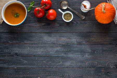 Homemade Pumpkin Soup on rustic wooden background, free space for text. Top viewの写真素材