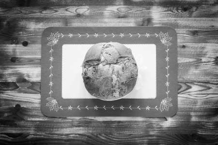 Traditional Italian Christmas cake with chocolate and various xmas decorations, free space for textの写真素材