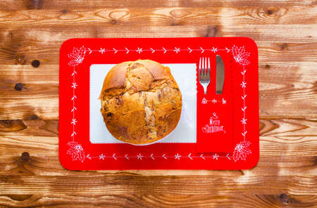 Traditional Italian Christmas cake with chocolate and various xmas decorations, free space for textの写真素材