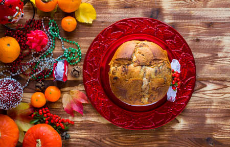 Traditional Italian Christmas cake with chocolate and various xmas decorations, free space for textの写真素材