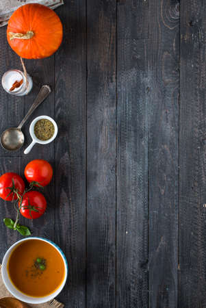 Homemade Pumpkin Soup on rustic wooden background, free space for text. Top viewの写真素材
