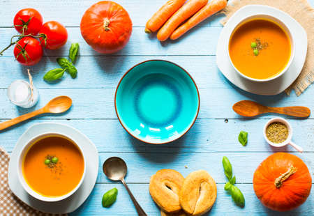 Homemade Pumpkin Soup on rustic wooden background, free space for text. Top viewの写真素材