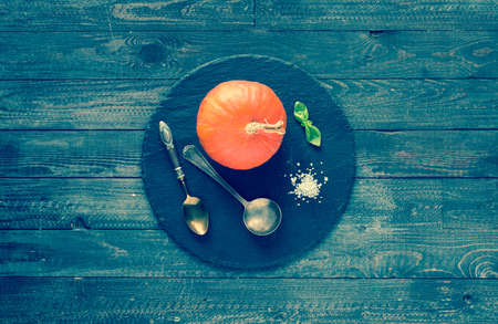 Homemade Pumpkin Soup on rustic wooden background, free space for text. Top viewの写真素材
