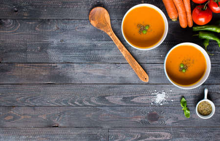 Homemade Pumpkin Soup on rustic wooden background, free space for text. Top viewの写真素材
