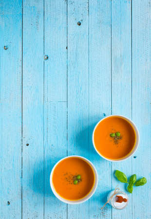 Homemade Pumpkin Soup on rustic wooden background, free space for text. Top viewの写真素材