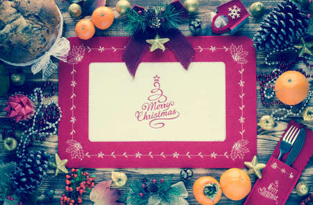 Traditional Italian Christmas cake with chocolate and various xmas decorations, free space for textの写真素材