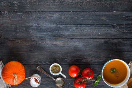 Homemade Pumpkin Soup on rustic wooden background, free space for text. Top viewの写真素材