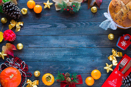Traditional Italian Christmas cake with chocolate and various xmas decorations, free space for textの写真素材