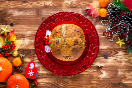 Traditional Italian Christmas cake with chocolate and various xmas decorations, free space for textの写真素材