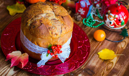 Traditional Italian Christmas cake with chocolate and various xmas decorations, free space for textの写真素材
