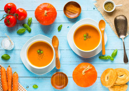 Homemade Pumpkin Soup on rustic wooden background, free space for text. Top viewの写真素材