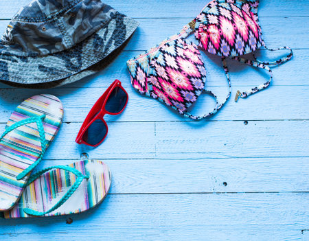 Summer fashion women swimsuit bikini, vacation concept, free space before text. Top view