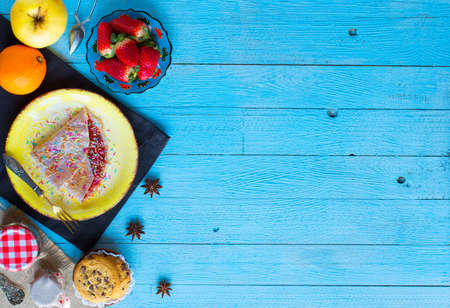 Fresh homemade crepes served on a plate with strawberries and blueberries, on a light blue wooden background, free space for text. Top viewの写真素材