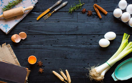 Chicken egg on a dark wooden background, free space for text. Top viewの写真素材