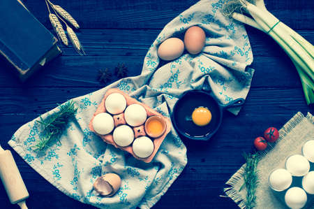 Chicken egg on a dark wooden background, free space for text. Top viewの写真素材