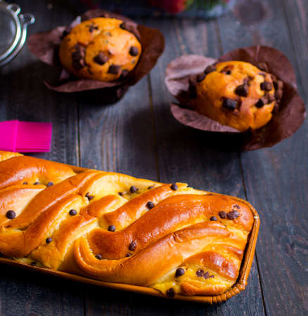 Breakfast with different pastries and fruits on a wooden table free space for textの写真素材