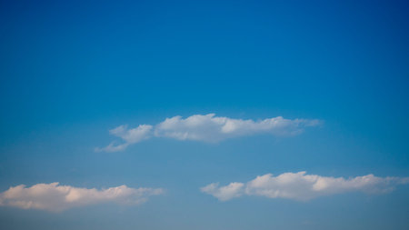 Beautiful blue sky with puffy clouds