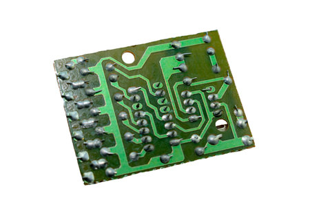 Electronic circuit board isolated on a white background. Close-up.