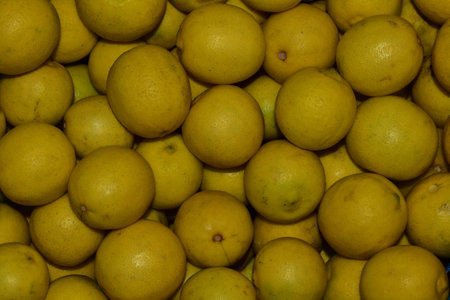 Lemons for sale in the market. Citrus background.