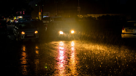 Heavy rain on road at night.