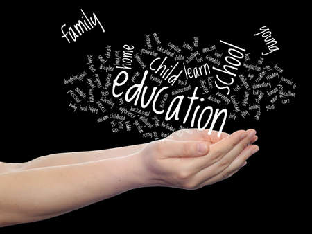 Conceptual education word cloud in hands isolated on backgroundの写真素材