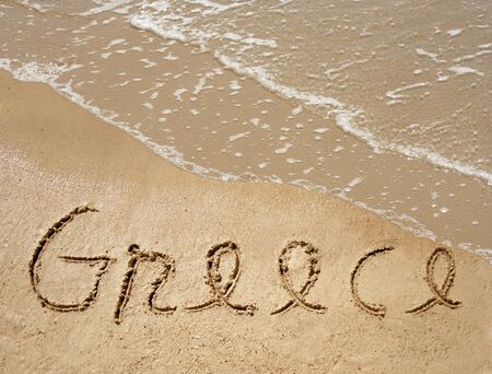 Conceptual Greece text in sand and water wave backgroundの写真素材
