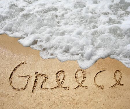 Conceptual Greece text in sand and water wave backgroundの写真素材