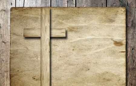 Old vintage Christian paper cross over wood wall backgroundの写真素材