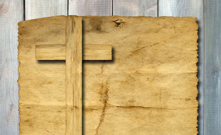 Old vintage Christian paper cross over wood wall backgroundの写真素材
