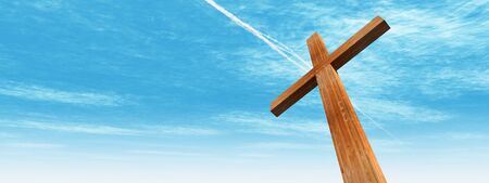 Concept or conceptual wood cross or religion symbol shape over a blue sky with clouds background bannerの写真素材